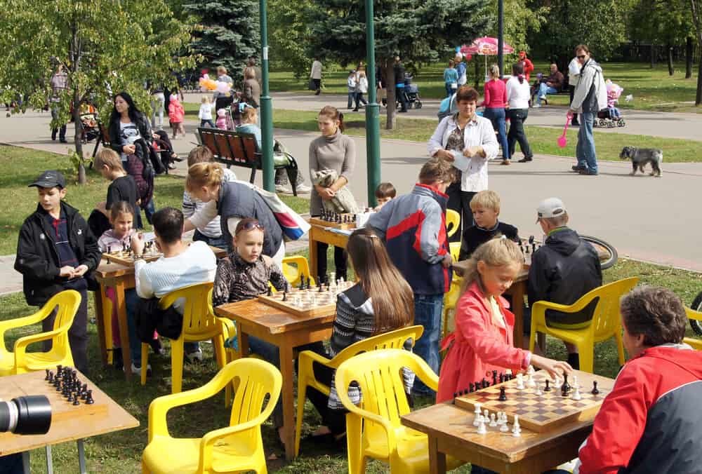 Children play chess. City Day celebrations in Moscow