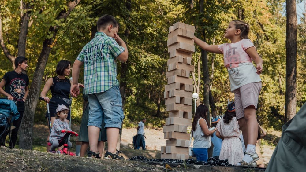 Kids in the Park playing Jenga