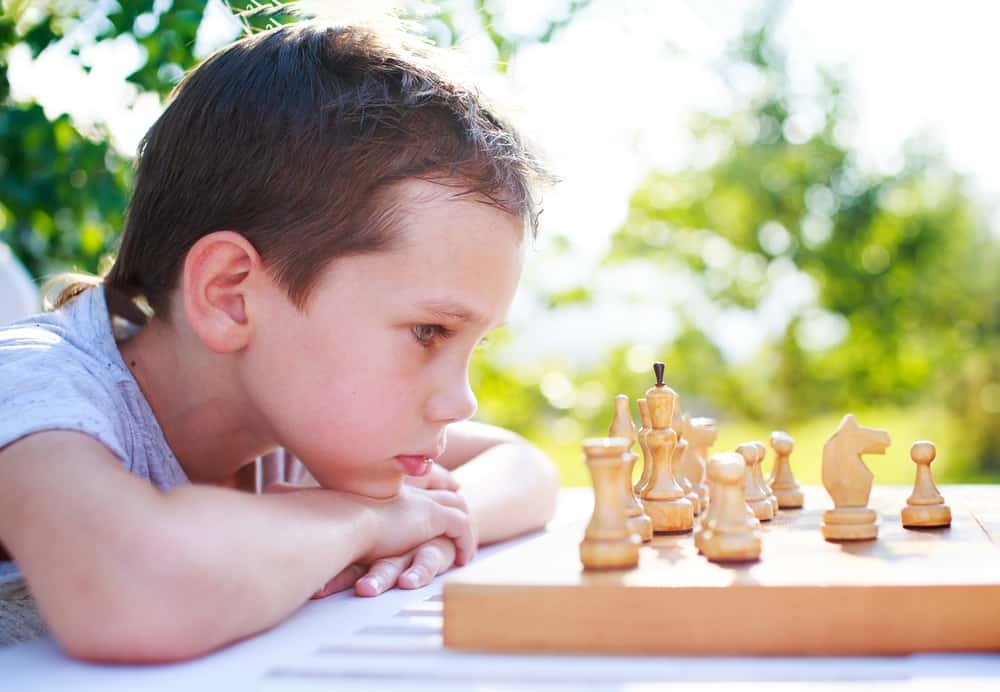young chess player outdoors
