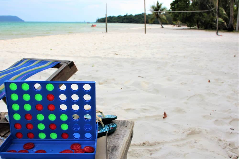 Connect 4 Board Game Being Played On the Beach