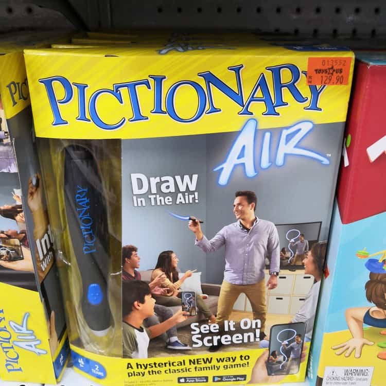 Pictionary game display for sale at Toys R Us in store shelf
