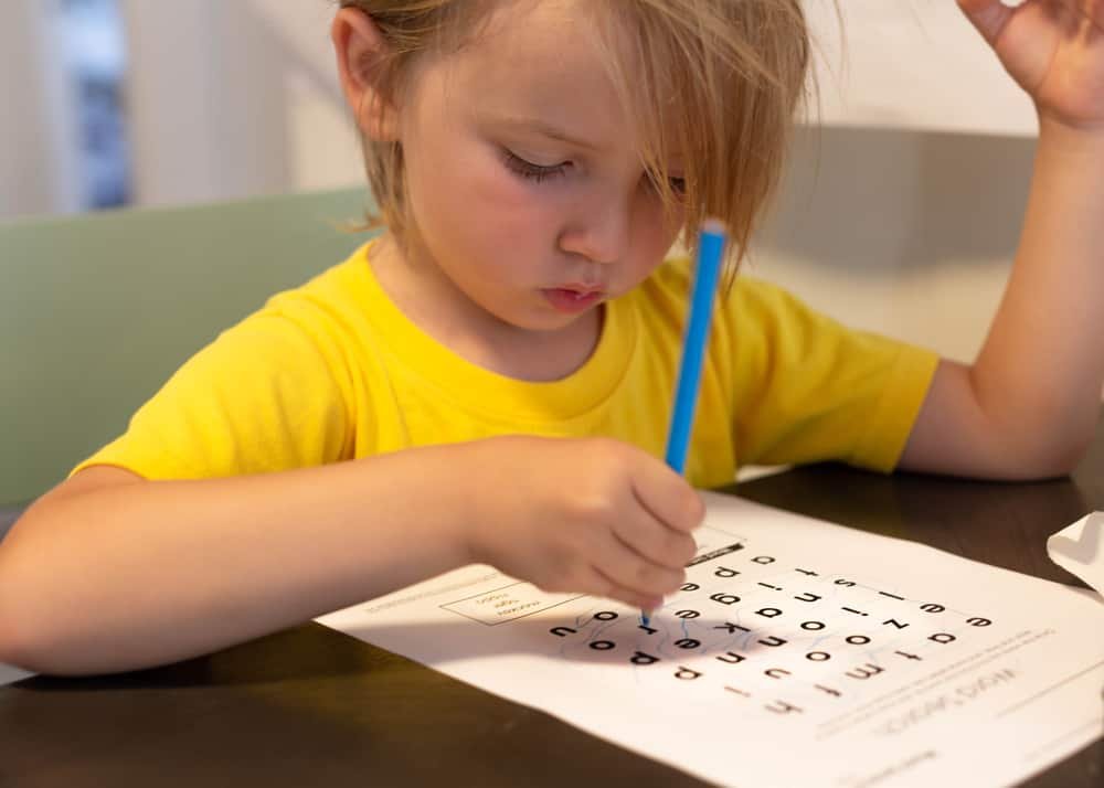 Child learning to read and write. Cross word puzzle game