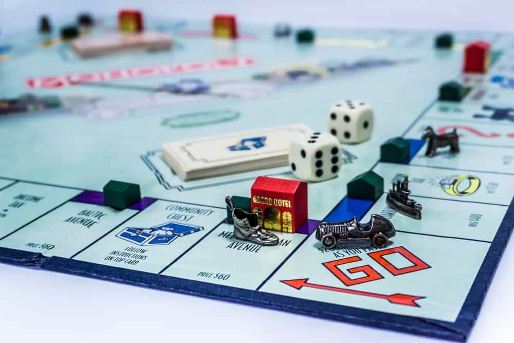 Monopoly Board Game with the car passing the GO