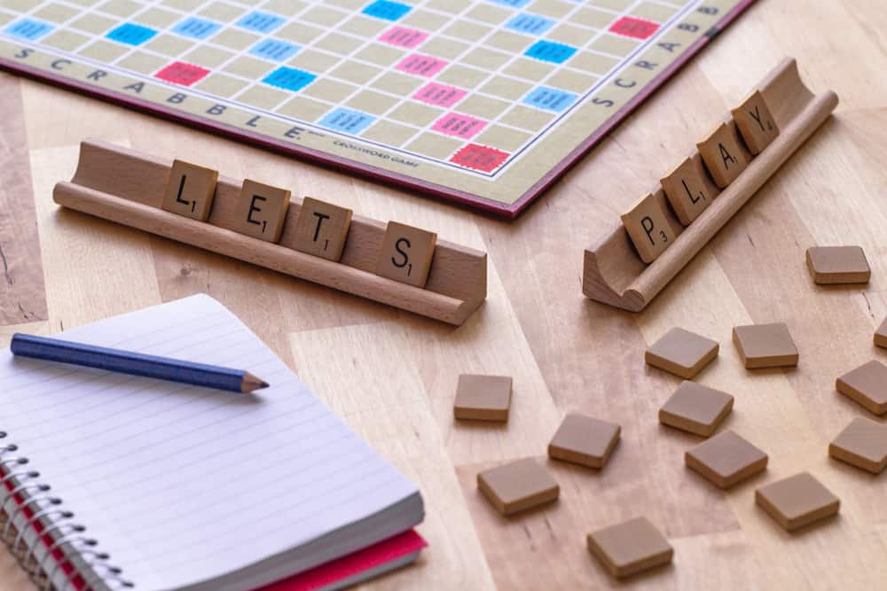 Scrabble board game with the scrabble tile spell Let's Play
