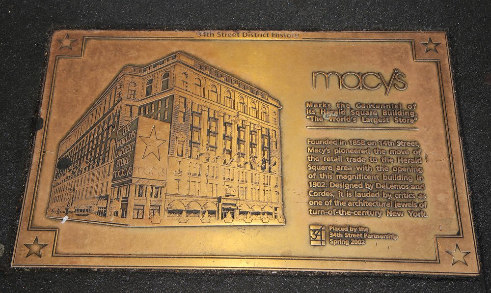 Sign marks the centennial of its Macy's Herald Square Building in midtown Manhattan