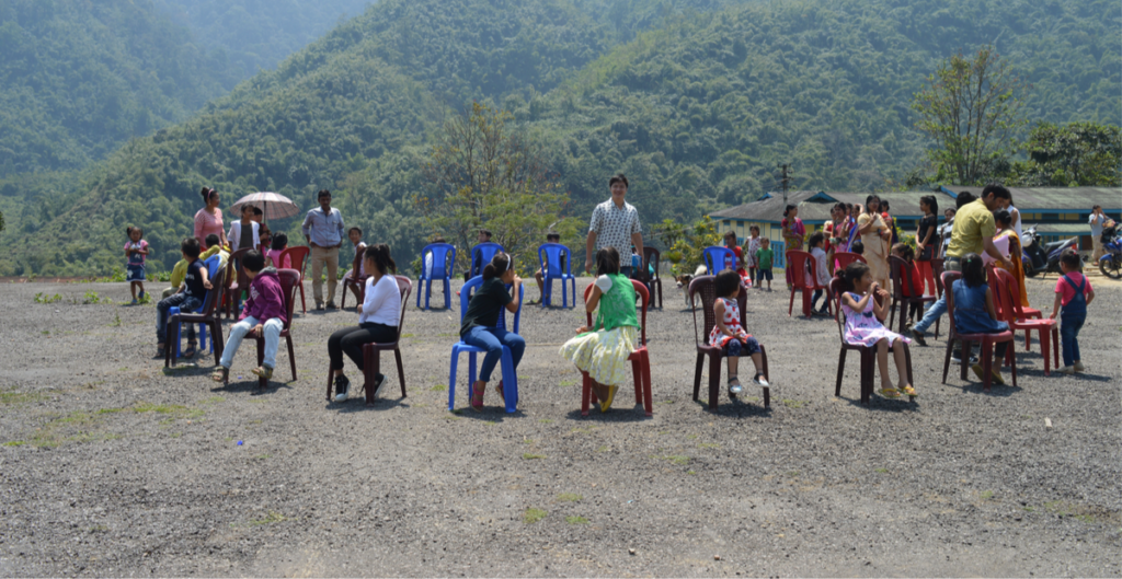 Group of children playing Musical Chair Game