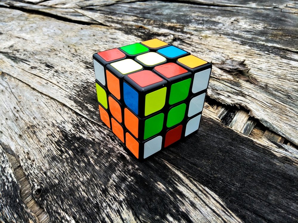 Closeup Rubik's cube on the old wooden vintage background