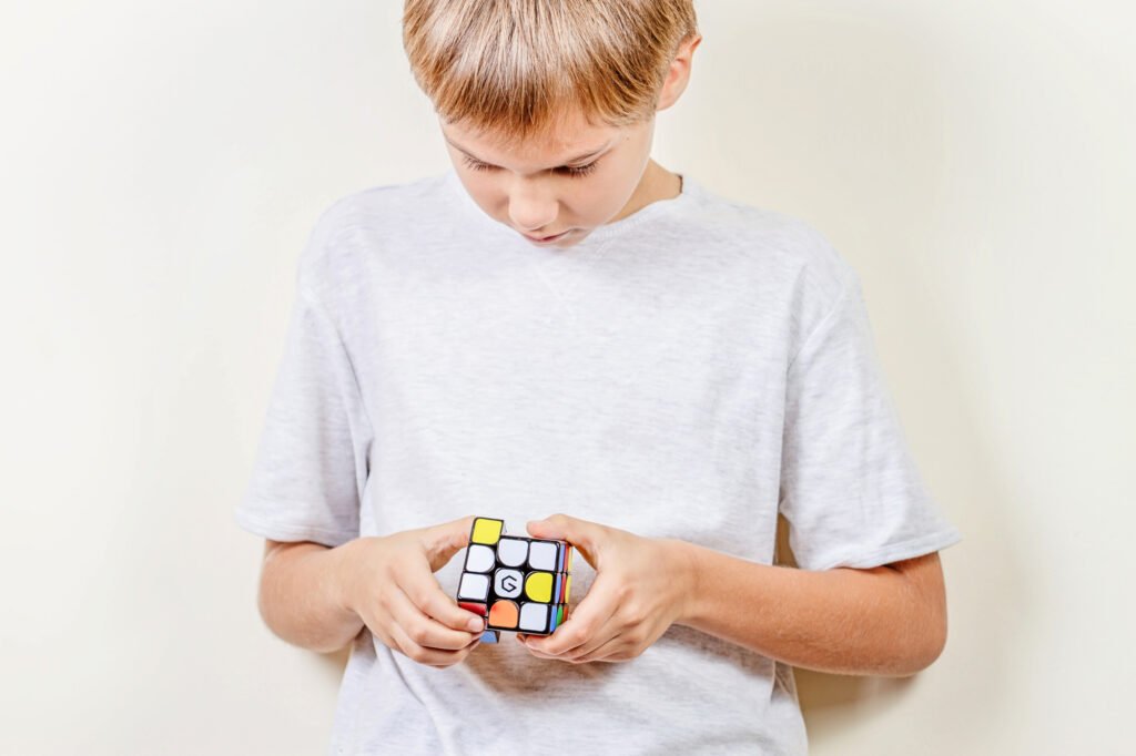 Kid playing with Magnetic Magic Cube