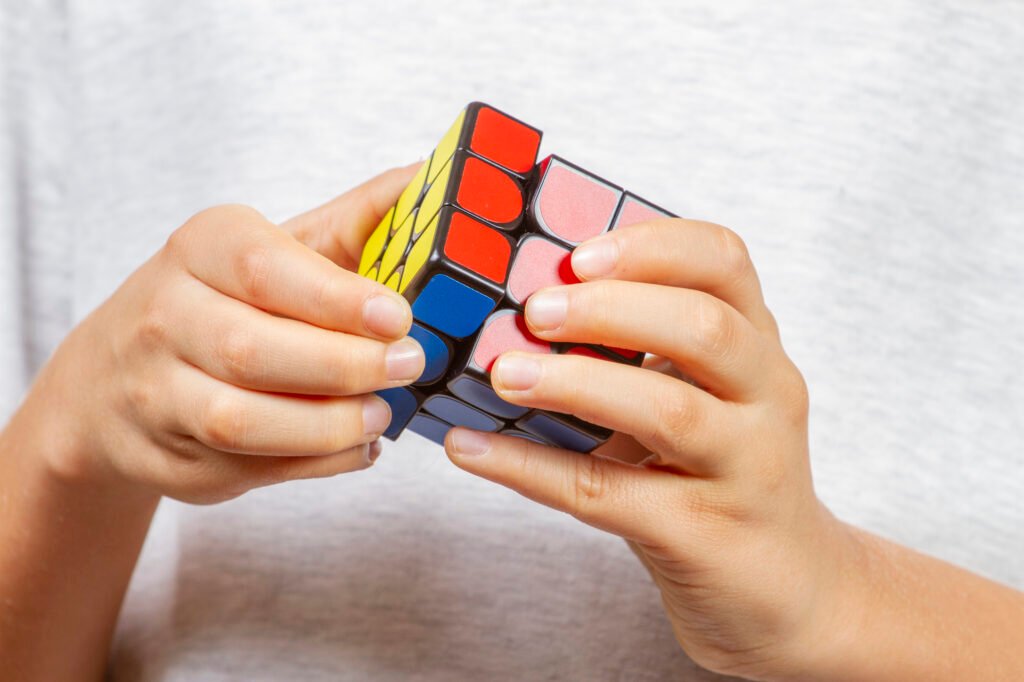 Kid playing with Rubik cube