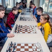 Kids play chess during chess competition