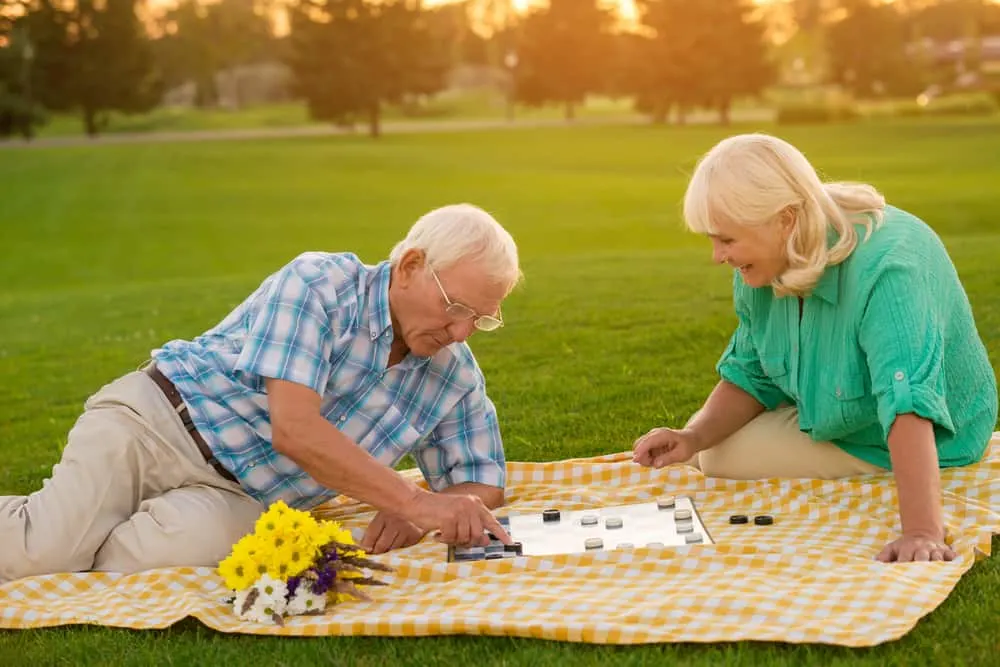 Senior couple plays checkers