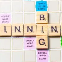 Words BIG and WINNING in scrabble letters over a scrabble board