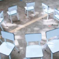 image of empty chairs. Musical chairs